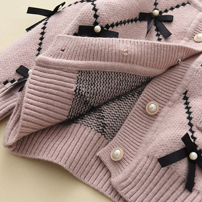 Cardigan With Black Bow Patterns And Black Pants Set