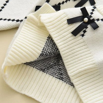 Cardigan With Black Bow Patterns And Black Pants Set